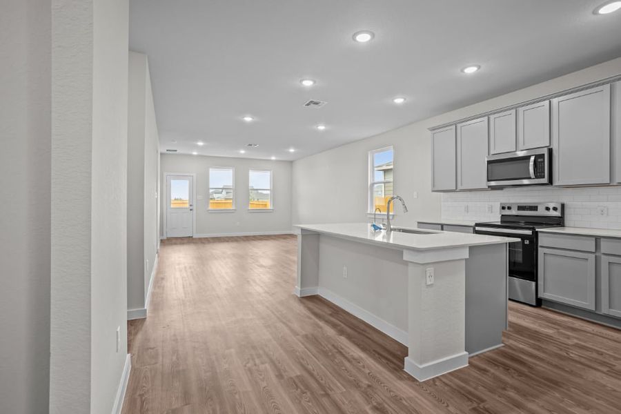 A kitchen with white cabinets. A kitchen with white cabinets.
