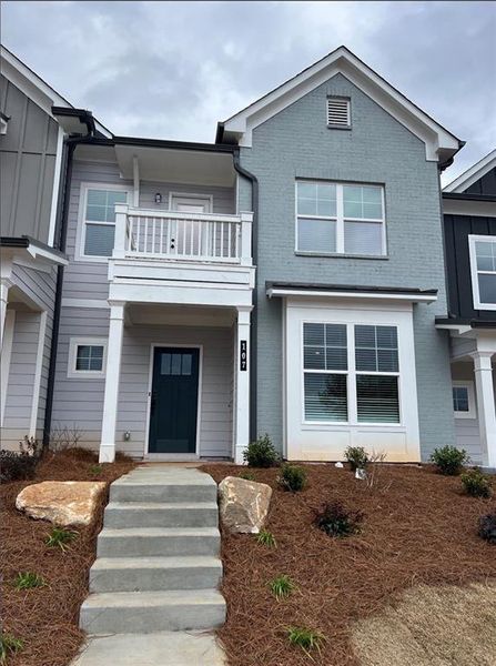 Front exterior of a new home in Apalachee Overlook, Winder, GA, highlighting curb appeal (Image 1). Front exterior of a new home in Apalachee Overlook, Winder, GA, highlighting curb appeal (Image 1).
