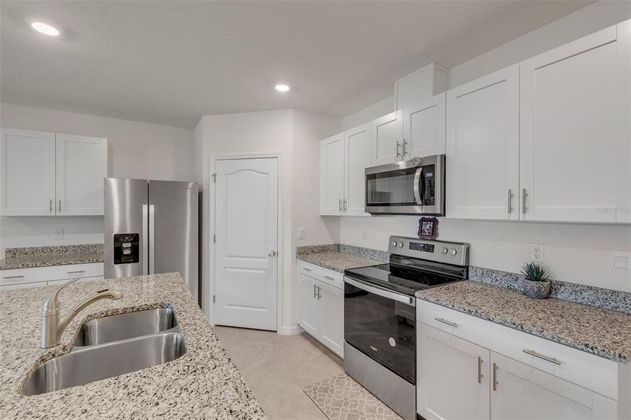 Furnished interior view inside a new home in Groveside at Ormond Station, Ormond Beach (Image 14).
