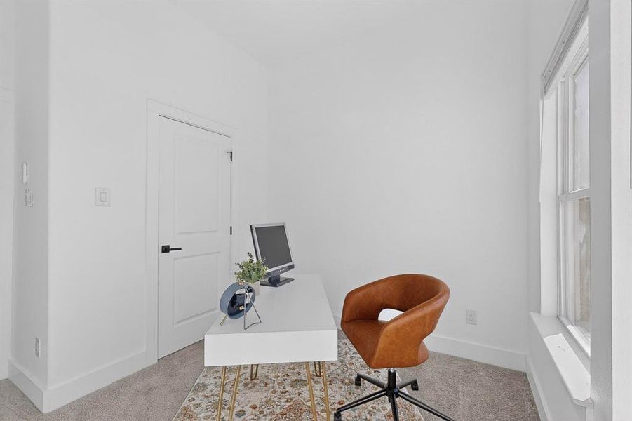 Carpeted office featuring baseboards