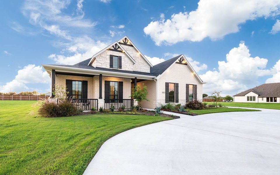 Front exterior of a new home in Marvida, Cypress, TX, highlighting curb appeal (Image 24).