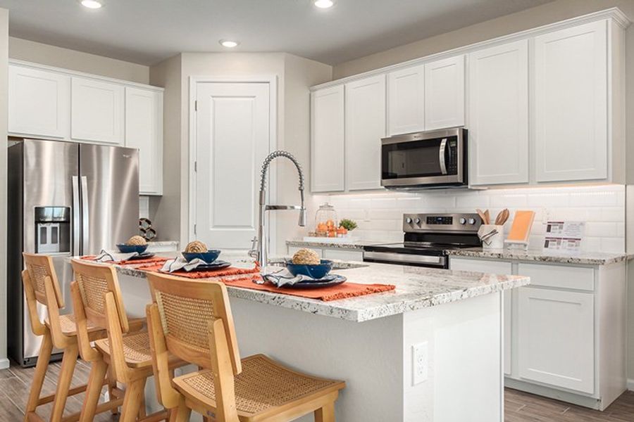 A kitchen with white cabinets. A kitchen with white cabinets.