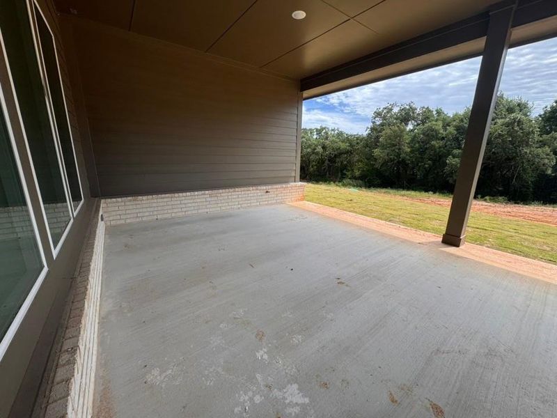 Exterior details and patio area of a home in Oak Grove Addition, Springtown (Image 4).