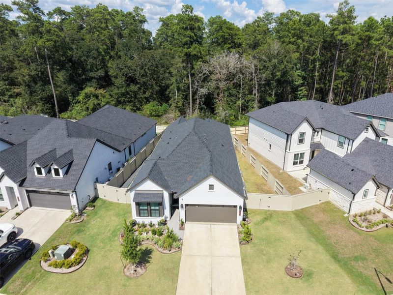 Front exterior of a new home in Audubon - Terrace Collection, Magnolia, TX, highlighting curb appeal (Image 22).