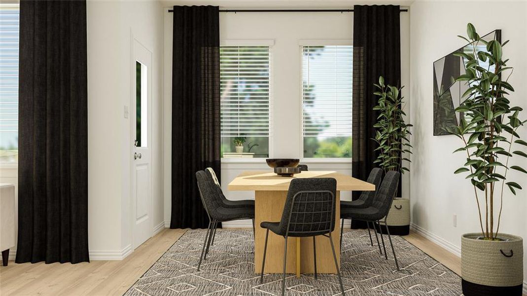 Dining space with hardwood / wood-style flooring