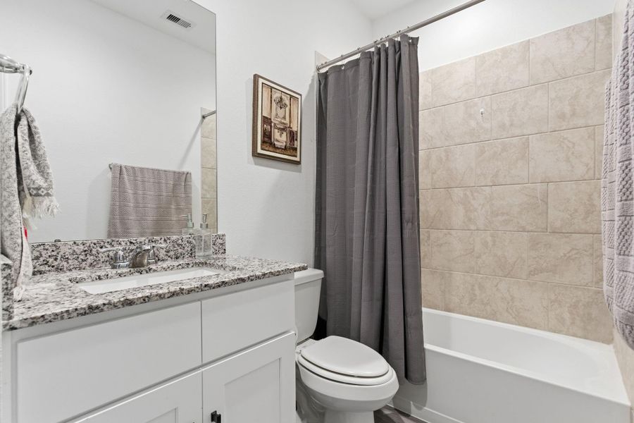 Luxurious ensuite with dual granite vanities, massive walk-in shower, and a large closet. Luxurious ensuite with dual granite vanities, massive walk-in shower, and a large closet.