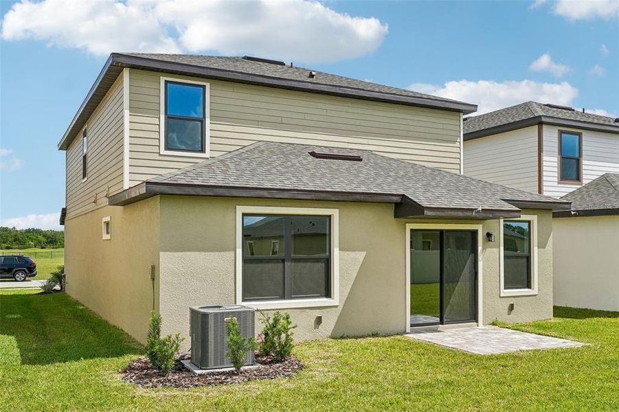 Exterior details and patio area of a home in Grasslands West, Lakeland (Image 25).