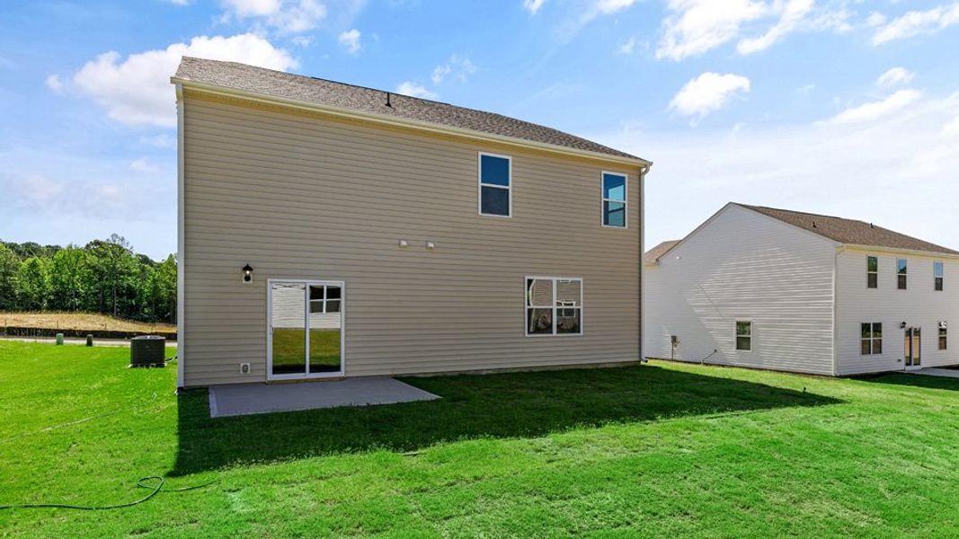 Exterior details and patio area of a home in East Ridge, Ayden (Image 21).