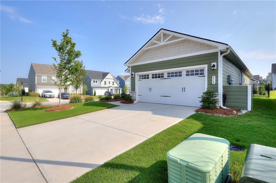Front exterior of a new home in , Hoschton, GA, highlighting curb appeal (Image 20).