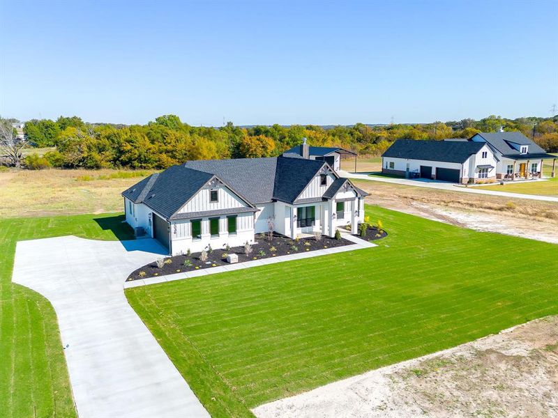 Front exterior of a new home in , Weatherford, TX, highlighting curb appeal (Image 18).