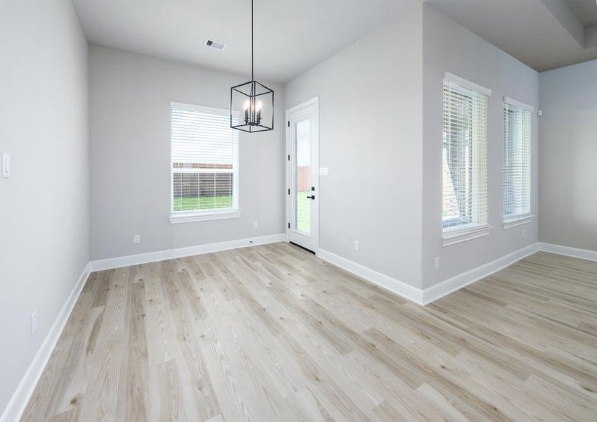 Off the kitchen you will find the dining area that overlooks the back yard.