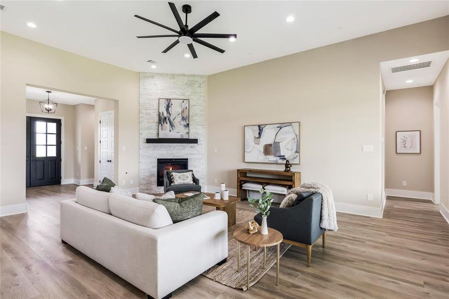 This living room features neutral tones, and light wood flooring throughout This living room features neutral tones, and light wood flooring throughout
