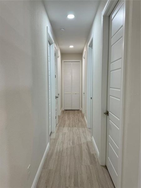 Hallway to Bedroom 1 & 2, Linen Closet, Pantry, & Utility Room Hallway to Bedroom 1 & 2, Linen Closet, Pantry, & Utility Room