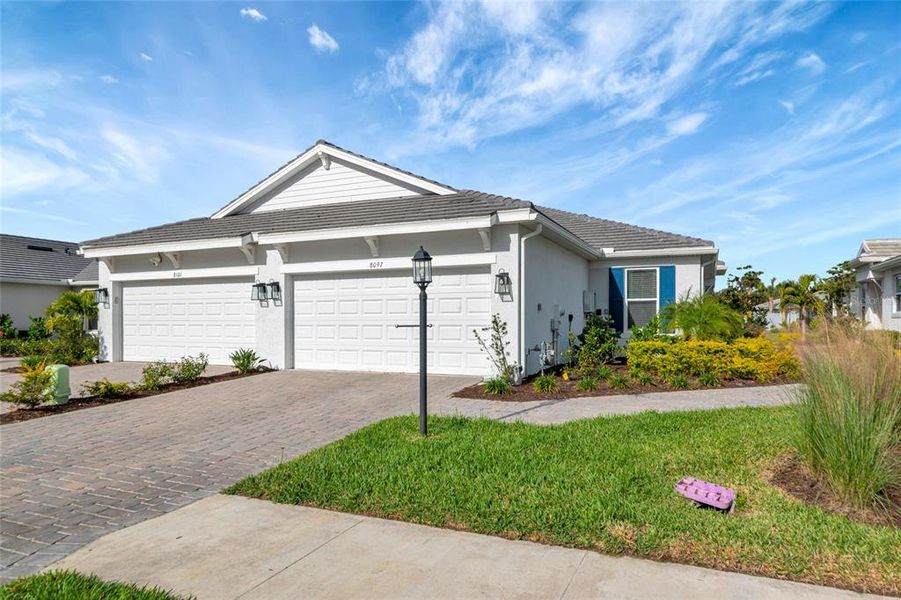 Front exterior of a new home in , Sarasota, FL, highlighting curb appeal (Image 26).