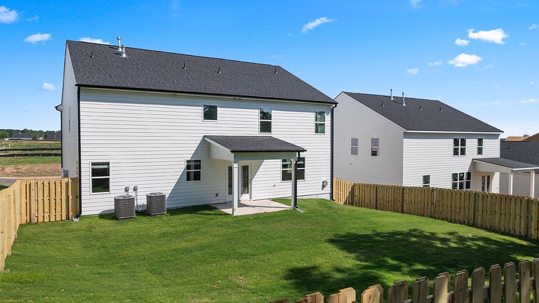 Exterior details and patio area of a home in Estates at Deer Hollow, Grovetown (Image 24).