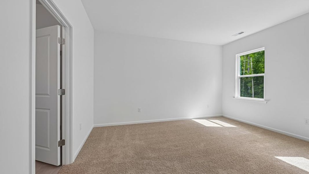 Spacious, unfurnished interior of a new home in The Villas at Laurel Oaks, Sanford (Image 15).