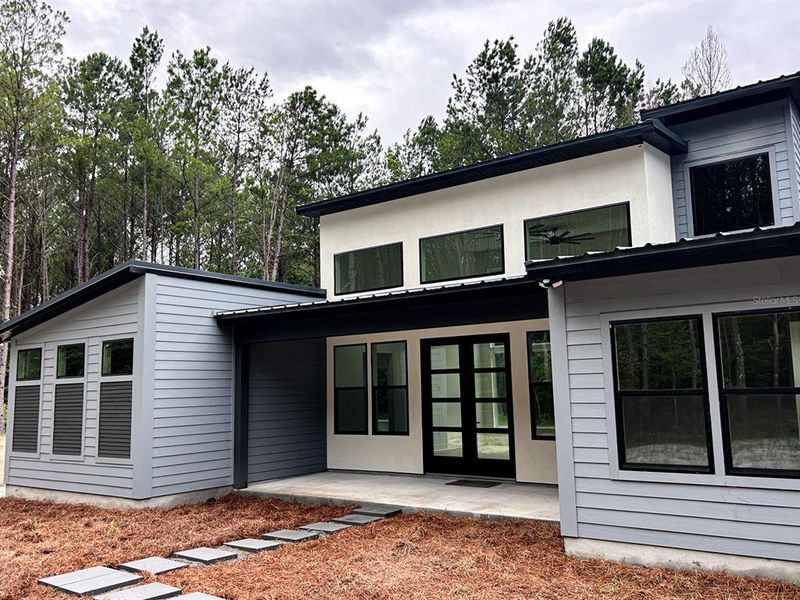 Front exterior of a new home in , Alachua, FL, highlighting curb appeal (Image 2). Front exterior of a new home in , Alachua, FL, highlighting curb appeal (Image 2).