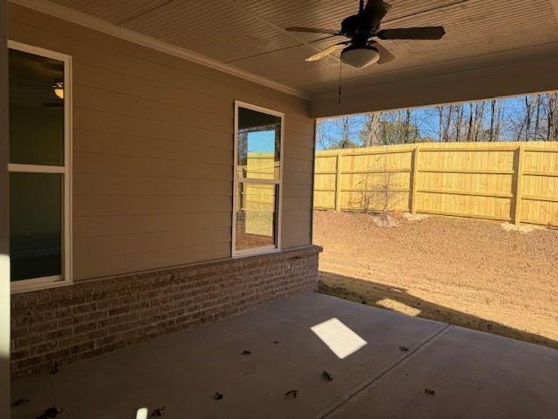 Exterior details and patio area of a home in Cooper's Walk, Loganville (Image 3).