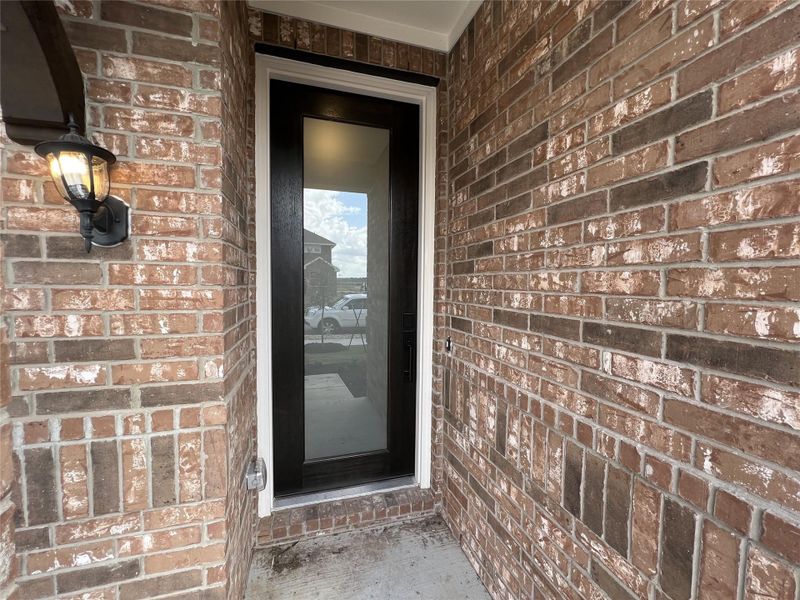 Exterior details and patio area of a home in Rolling Glen, Hutto (Image 21).