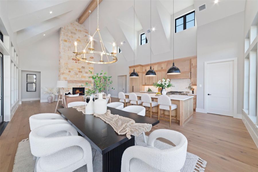 Elegant dining space with designer chandelier and open layout.