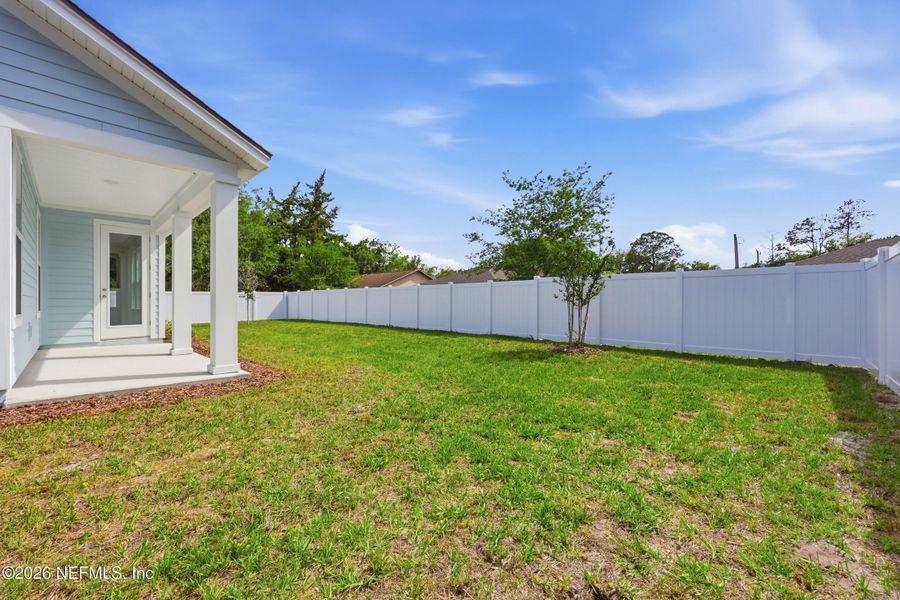 Exterior details and patio area of a home in Palm Coast Homes, Palm Coast (Image 4).