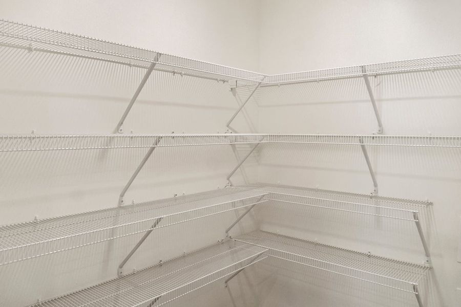 Walk-in closet at primary suite