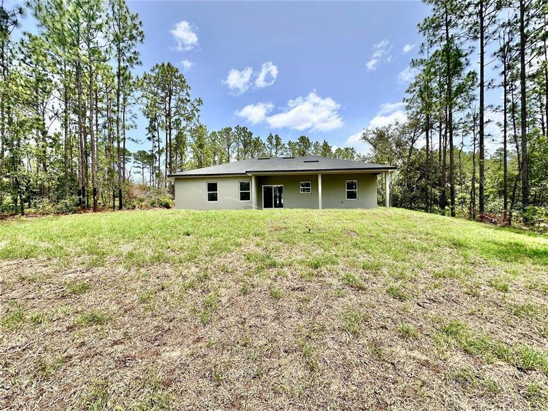 Exterior details and patio area of a home in , Citrus Springs (Image 3).