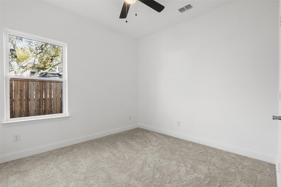 Unfurnished room with carpet flooring and ceiling fan