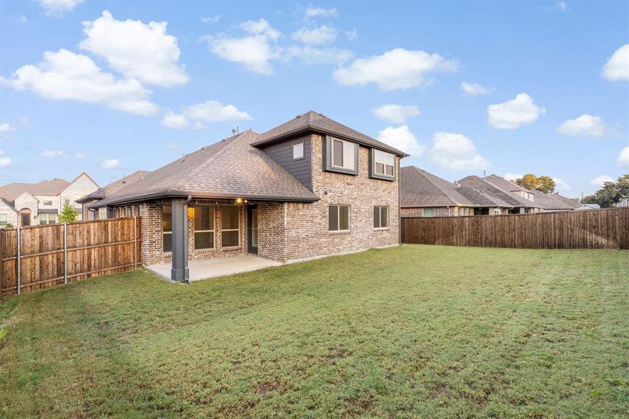 Exterior details and patio area of a home in , Little Elm (Image 3). Exterior details and patio area of a home in , Little Elm (Image 3).