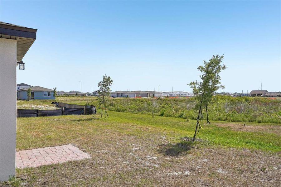 Exterior details and patio area of a home in Lake Deer Estates - Signature Series, Poinciana (Image 24). Exterior details and patio area of a home in Lake Deer Estates - Signature Series, Poinciana (Image 24).