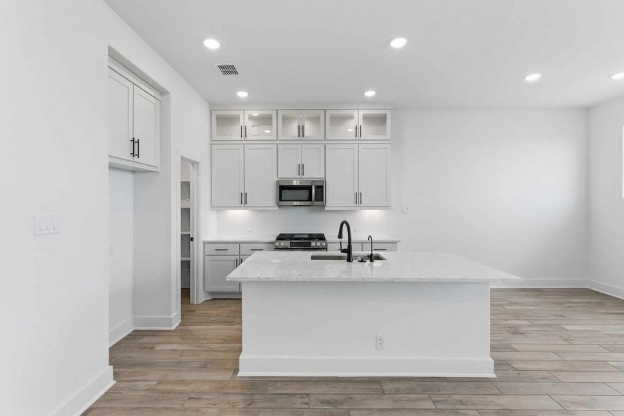 Furnished interior view inside a new home in Centero at Stone Oak, San Antonio (Image 7).