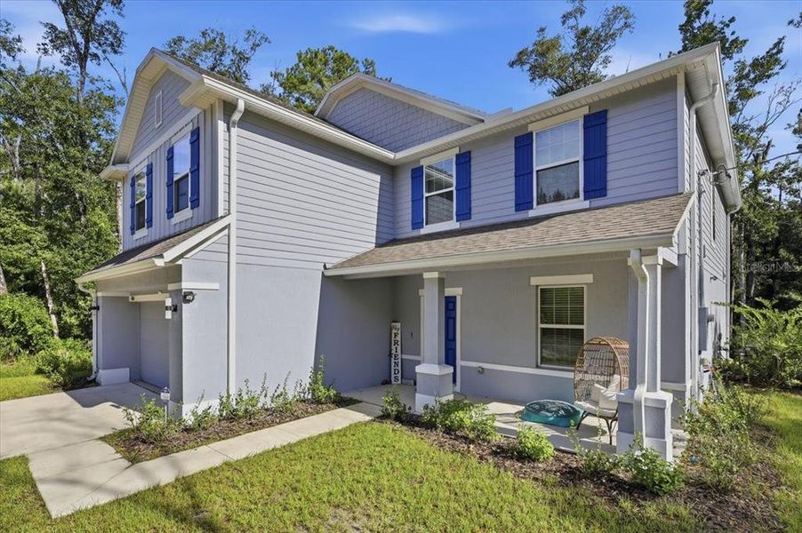 Front exterior of a new home in Flagler Estates, Hastings, FL, highlighting curb appeal (Image 28).