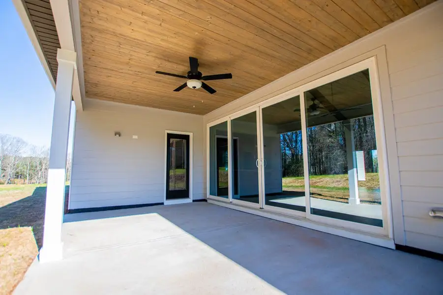Exterior details and patio area of a home in The Reserve at Red Oaks, Carrollton (Image 4).