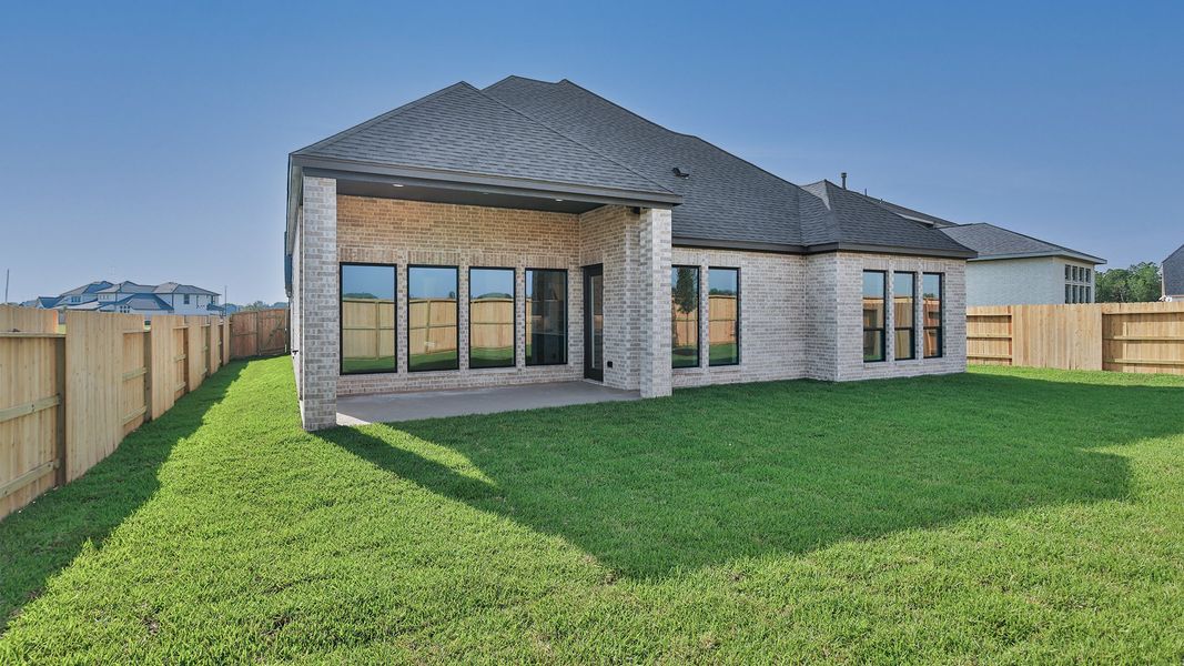 Exterior details and patio area of a home in Legacy Prairie at Katy Court, Katy (Image 2).