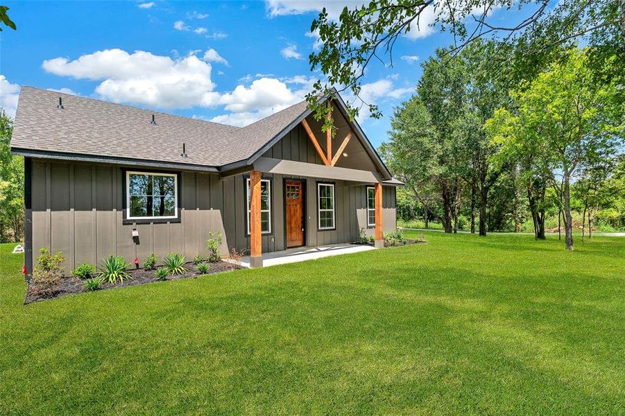 Front exterior of a new home in , Ennis, TX, highlighting curb appeal (Image 22). Front exterior of a new home in , Ennis, TX, highlighting curb appeal (Image 22).