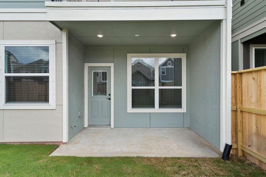 Exterior details and patio area of a home in Meridiana, Manvel (Image 3).