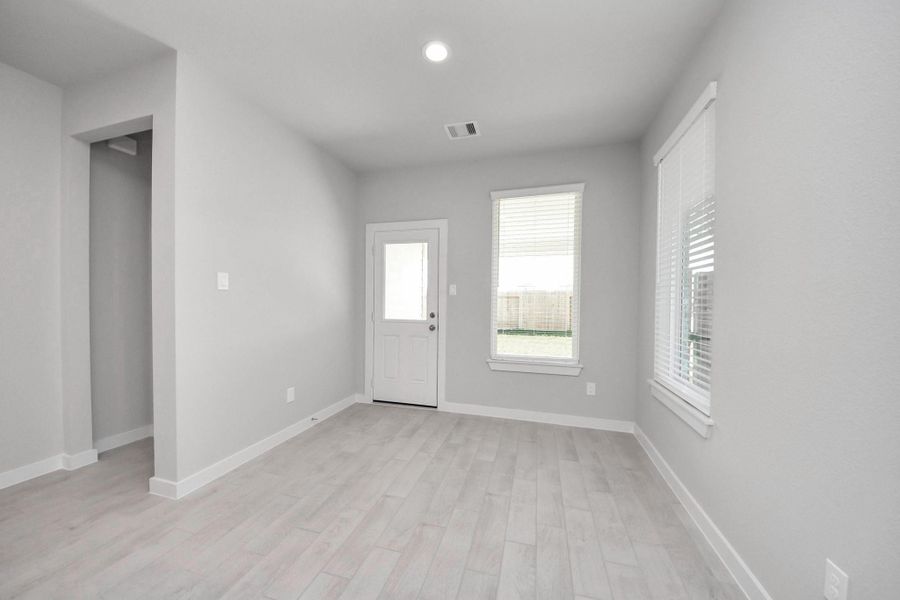 Enjoy breakfast with ease in the connected and cozy breakfast area, seamlessly integrated with the kitchen for utmost convenience. Step through the back door for a breath of fresh air onto the covered patio, extending your living space to the outdoors. Sample photo of completed home with similar floor plan. Actual colors and selections may vary. Enjoy breakfast with ease in the connected and cozy breakfast area, seamlessly integrated with the kitchen for utmost convenience. Step through the back door for a breath of fresh air onto the covered patio, extending your living space to the outdoors. Sample photo of completed home with similar floor plan. Actual colors and selections may vary.