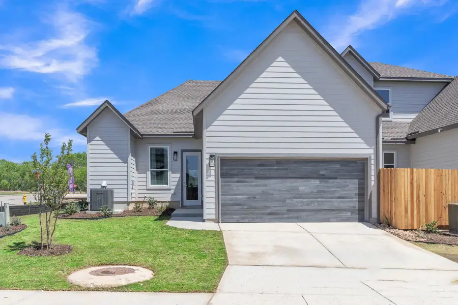 Front exterior of a new home in VIDA Townhomes, San Antonio, TX, highlighting curb appeal (Image 2). Front exterior of a new home in VIDA Townhomes, San Antonio, TX, highlighting curb appeal (Image 2).