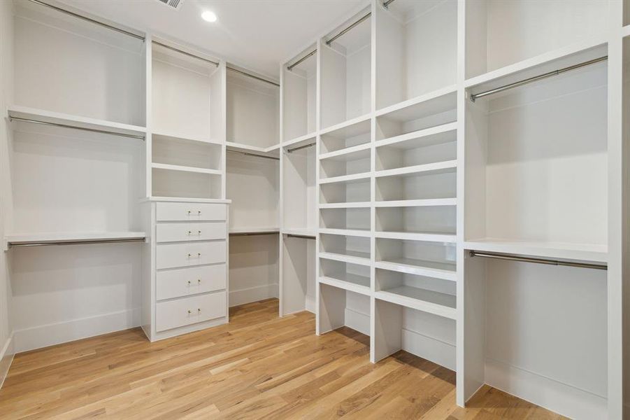 Spacious closet with hardwood and drawers