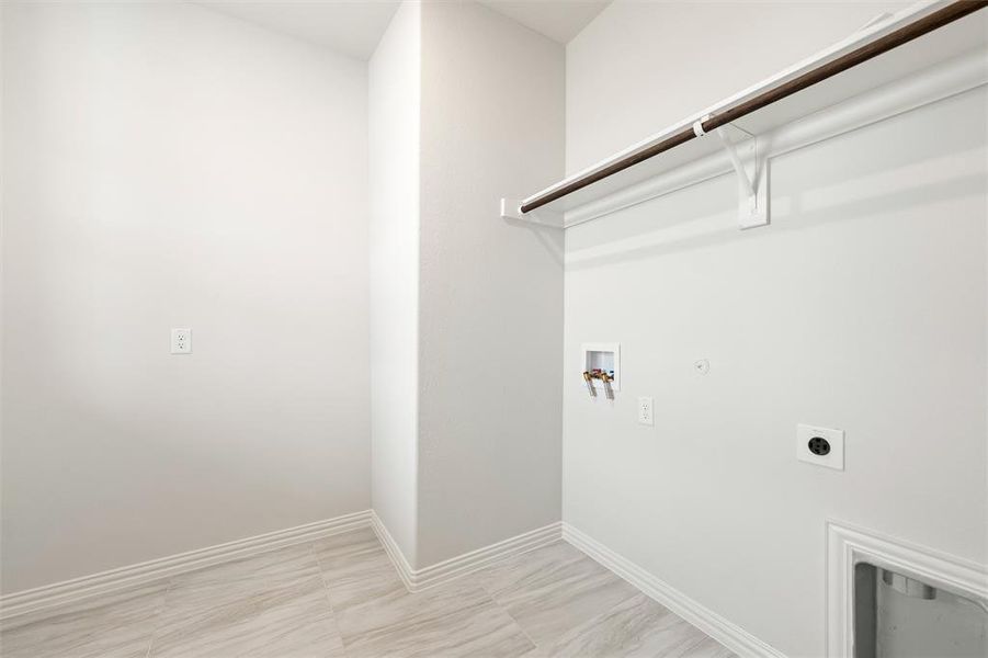 Laundry room featuring washer hookup, electric dryer hookup, and gas dryer hookup