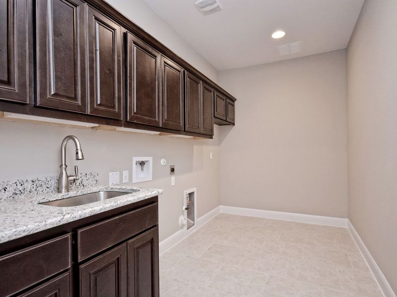 Representative furnished interior of a home built from the Madera II by Giddens Homes in Scofield Farms Estates, Georgetown (Image 210).