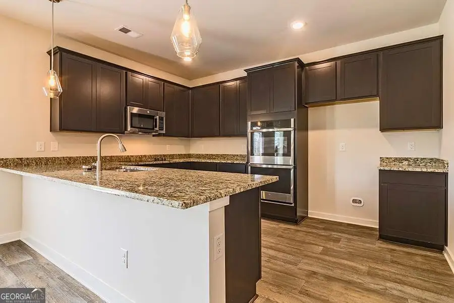 Furnished interior view inside a new home in Fern Dale, Fairburn (Image 8).