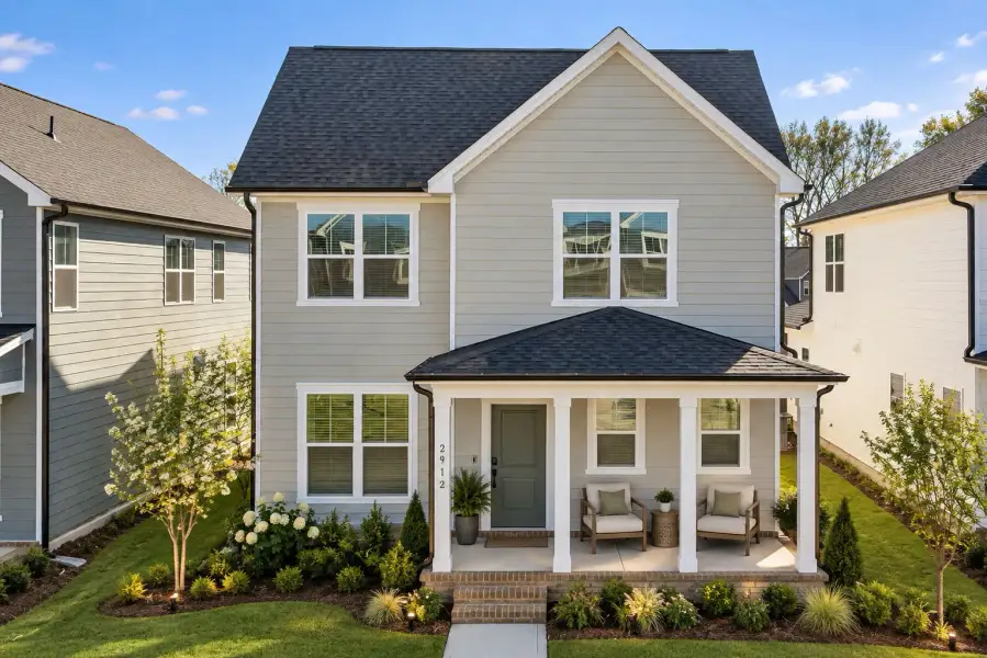 Front exterior of a new home in Saunders Farm, Willow Spring, NC, highlighting curb appeal (Image 2). Front exterior of a new home in Saunders Farm, Willow Spring, NC, highlighting curb appeal (Image 2).