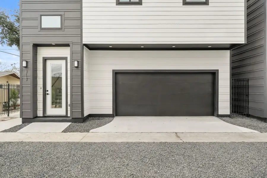 A spacious two car smart garage is equipped with myQ app connectivity for remote access and monitoring, plus a dedicated storage closet for tools, seasonal items or outdoor gear. A spacious two car smart garage is equipped with myQ app connectivity for remote access and monitoring, plus a dedicated storage closet for tools, seasonal items or outdoor gear.