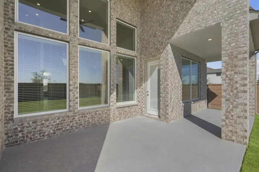Representative exterior details of a home built from the Waterford by Chesmar Homes in Meridiana 60's, Manvel (Image 3).