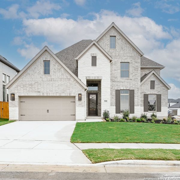 Front exterior of a new home in Mayfair 60', New Braunfels, TX, highlighting curb appeal (Image 18). Front exterior of a new home in Mayfair 60', New Braunfels, TX, highlighting curb appeal (Image 18).