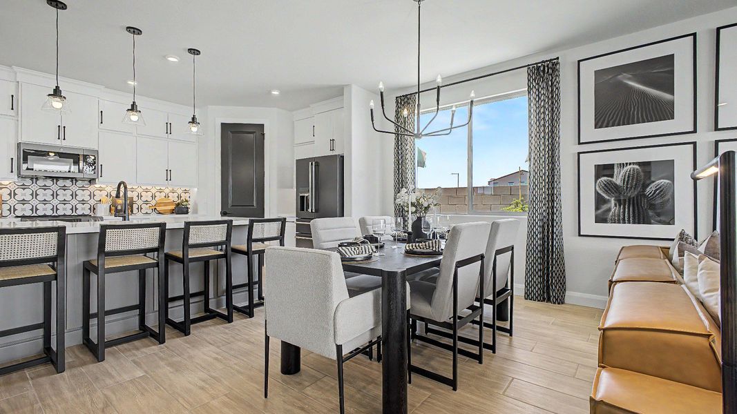 Bright, open dining area and great room in this quick move-in new home by DRB Homes at Saguaro Hills at Vistancia. Bright, open dining area and great room in this quick move-in new home by DRB Homes at Saguaro Hills at Vistancia.