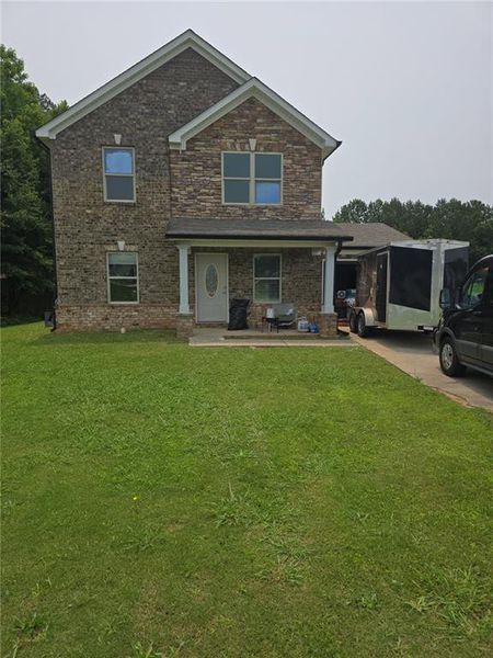 Front exterior of a new home in , Jonesboro, GA, highlighting curb appeal (Image 1).
