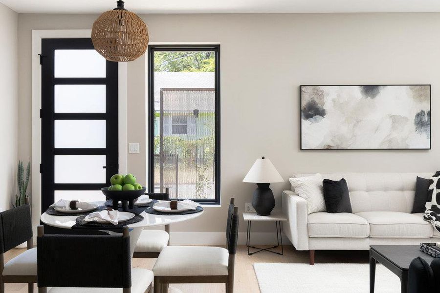 Living area featuring wood finished floors and baseboards Living area featuring wood finished floors and baseboards