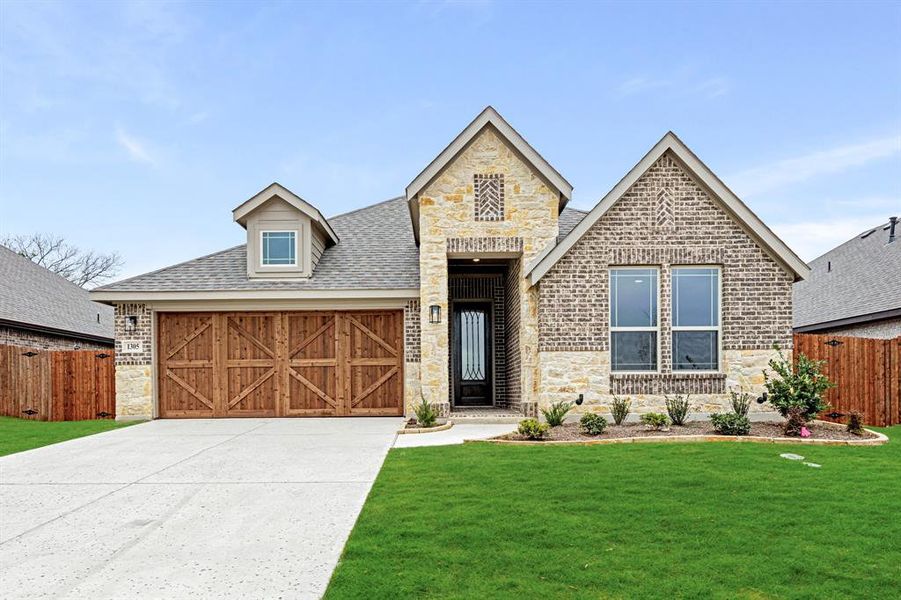 Front exterior of a new home in The Oaks, Red Oak, TX, highlighting curb appeal (Image 2). Front exterior of a new home in The Oaks, Red Oak, TX, highlighting curb appeal (Image 2).